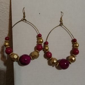 Tear drop earrings with purple and gold beading
